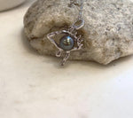 Unique Tahitian pearl eye pendant with extreme luster and detailed copper jewelry design