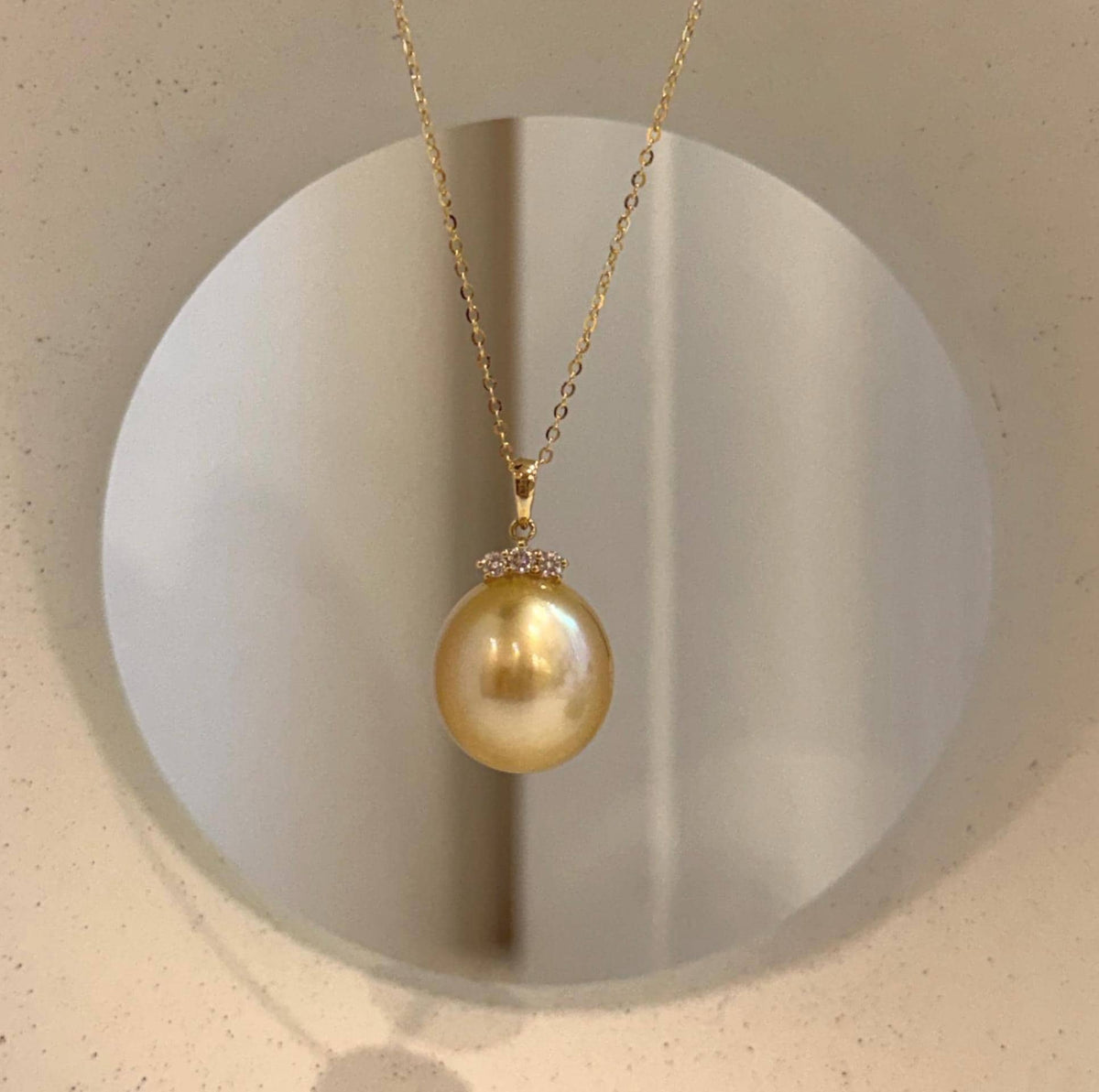Luxury South Sea golden pearl moissanite pendant featuring a distinctive deep tea gold tone and brilliant mirror luster.