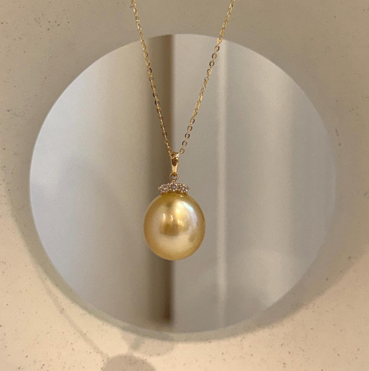 Deep tea gold South Sea pearl pendant combining a genuine saltwater pearl, brilliant moissanite and fine 18K gold.