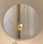 Deep tea gold South Sea pearl pendant combining a genuine saltwater pearl, brilliant moissanite and fine 18K gold.