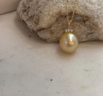 Statement South Sea golden pearl pendant with rich tea gold color, exceptional mirror luster and moissanite detailing.