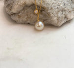 Genuine golden ocean pearl pendant with beautiful iridescent tones and a minimalist sterling silver necklace design.