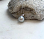 Genuine Tahitian saltwater pearl necklace with an 11.9mm pearl displaying rich natural color and bright mirror luster.