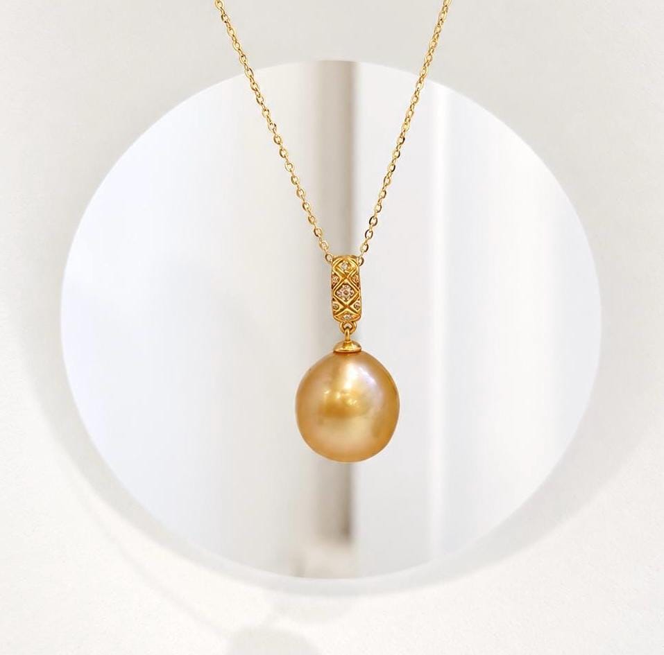 Genuine saltwater South Sea golden pearl pendant with rich deep tea gold color and brilliant luster.