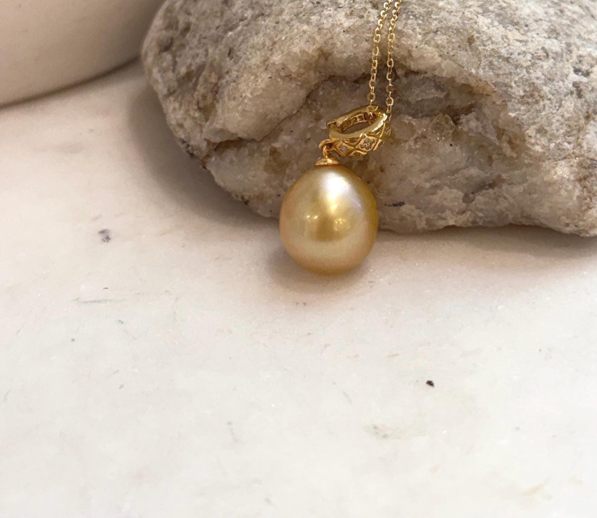 Genuine South Sea saltwater pearl pendant with rare deep golden tea tone and sterling silver design.