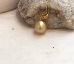 Genuine South Sea saltwater pearl pendant with rare deep golden tea tone and sterling silver design.