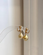 Cute cat earrings featuring genuine South Sea golden pearls with rich deep tea color and strong reflective luster.
