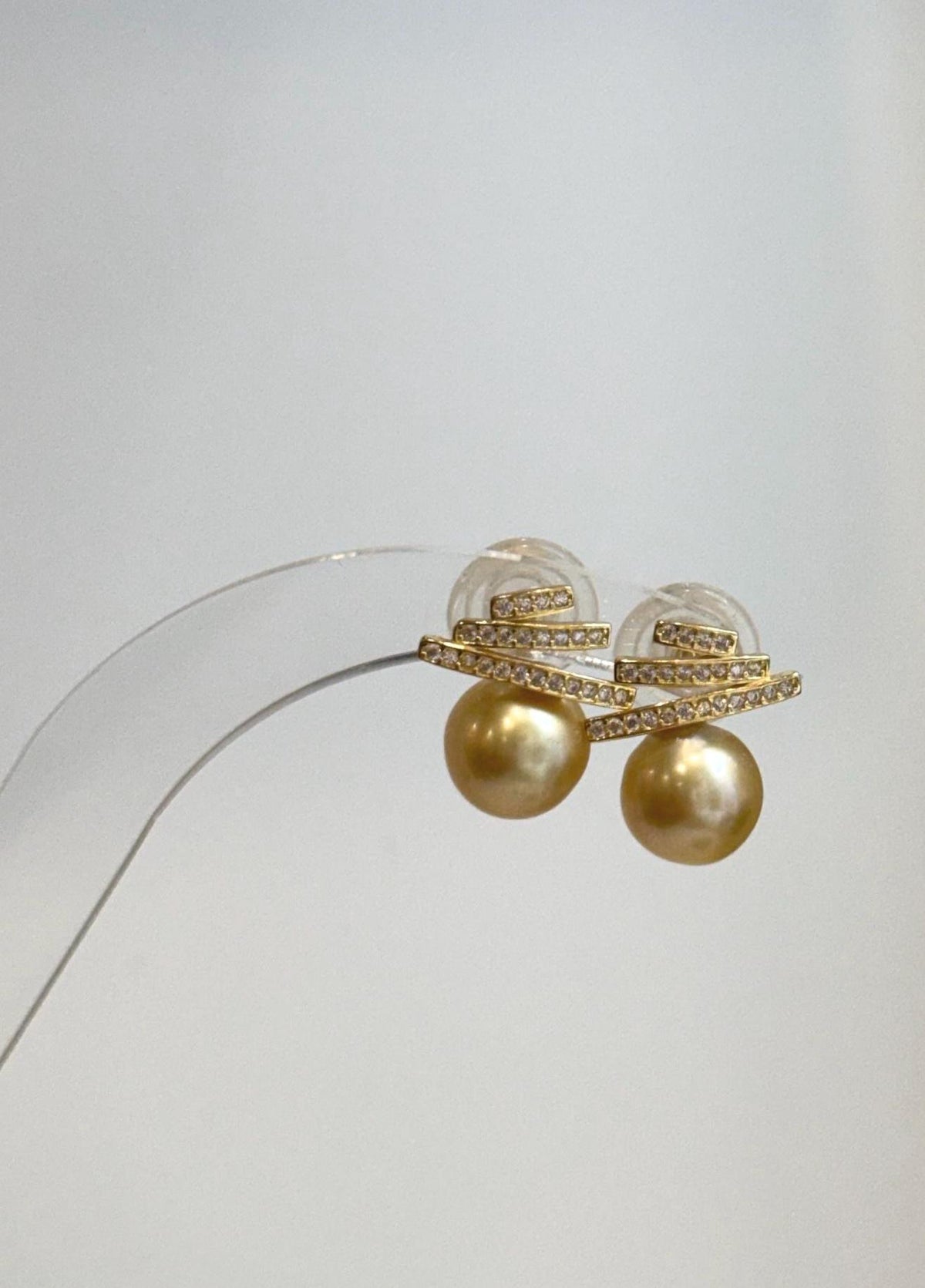 Genuine South Sea golden pearl earrings with rich deep tea color and elegant geometric Art Deco details.