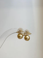 Art Deco South Sea golden pearl earrings with strong luster, clean geometric lines, and sterling silver.