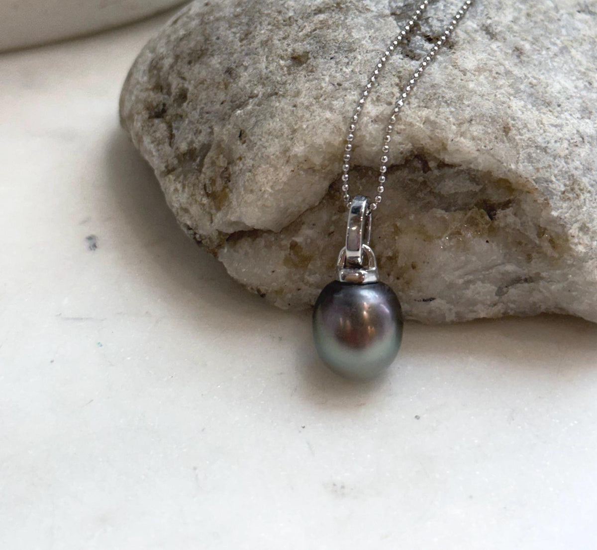 Genuine Tahitian saltwater pearl pendant with elegant vintage inspired sterling silver setting and matching chain
