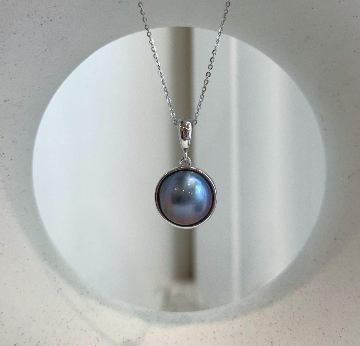 Purple iridescent Ocean round Mabe pearl pendant with extreme mirror luster and S925 sterling silver setting