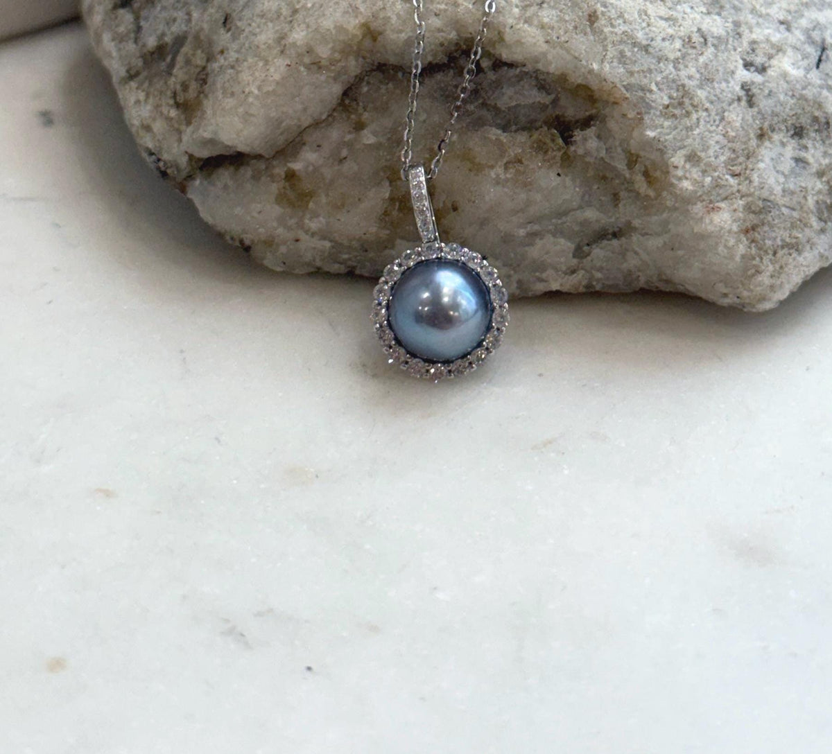 Genuine Akoya saltwater pearl pendant featuring a luminous platinum color and brilliant reflective luster