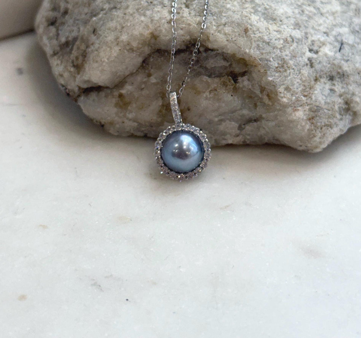 Akoya platinum pearl necklace with elegant halo design and sparkling sterling silver setting