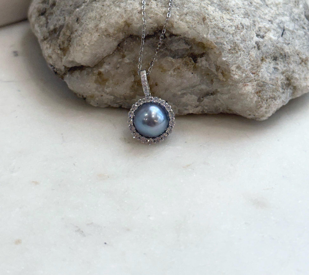 Sterling silver halo pearl pendant set with genuine Akoya saltwater pearl and extreme luster