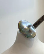 Rainbow Ocean Mabe pearl jewelry featuring vivid iridescent colors and smooth reflective surface