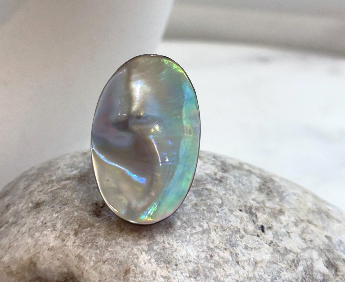 Genuine Ocean pearl ring featuring an organic oval Mabe pearl with strong rainbow iridescence