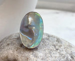 Genuine Ocean pearl ring featuring an organic oval Mabe pearl with strong rainbow iridescence