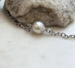Large white saltwater pearl necklace featuring bright luster and minimalist silver chain design