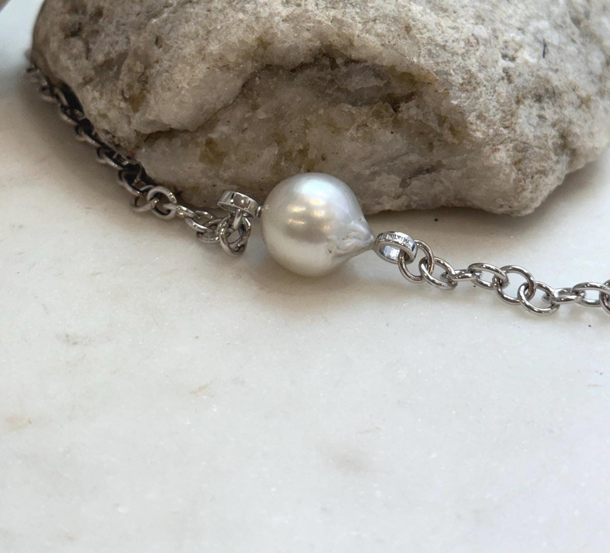 Large white saltwater pearl necklace featuring bright luster and minimalist silver chain design