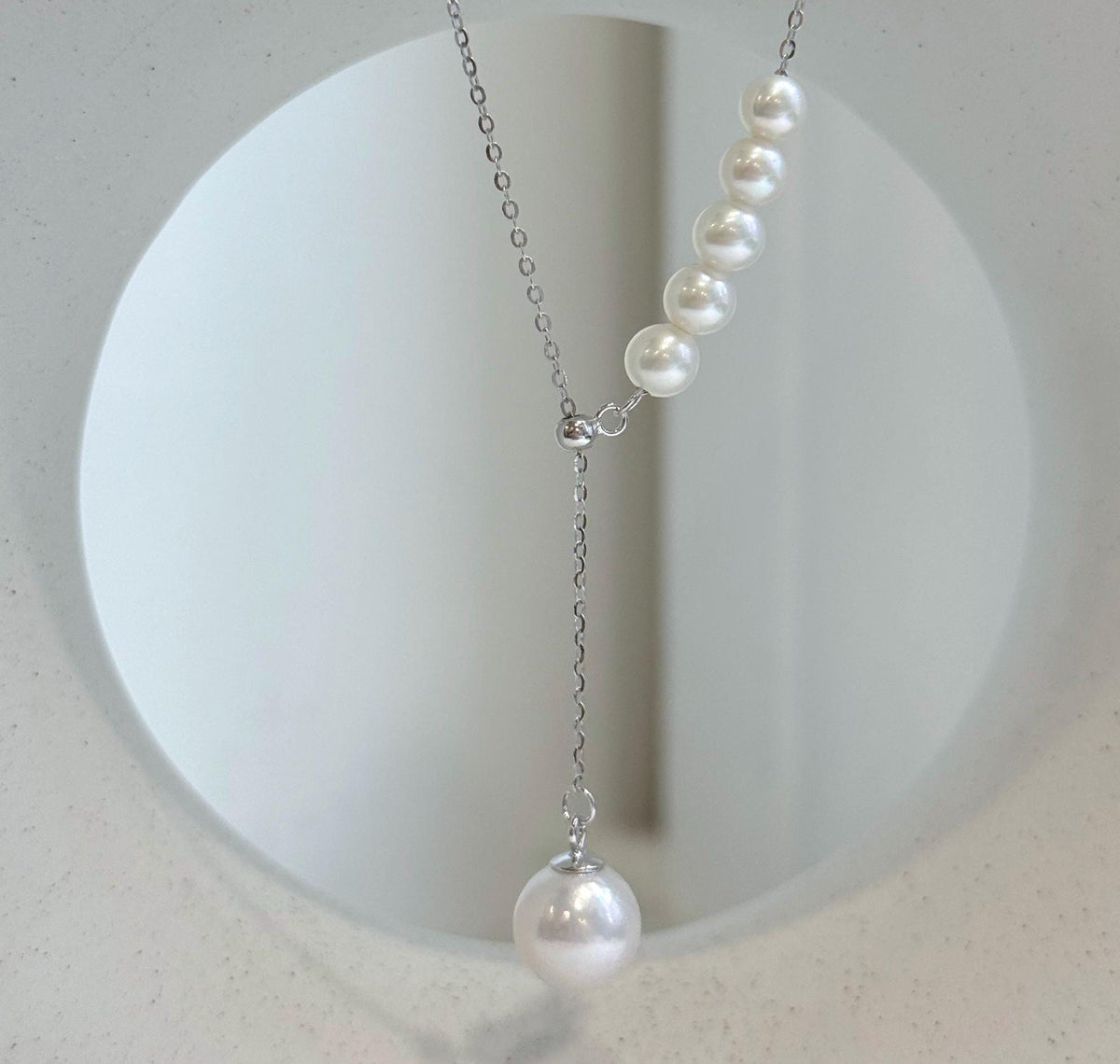 White freshwater pearl Y-lariat necklace with round pearls and extreme mirror luster