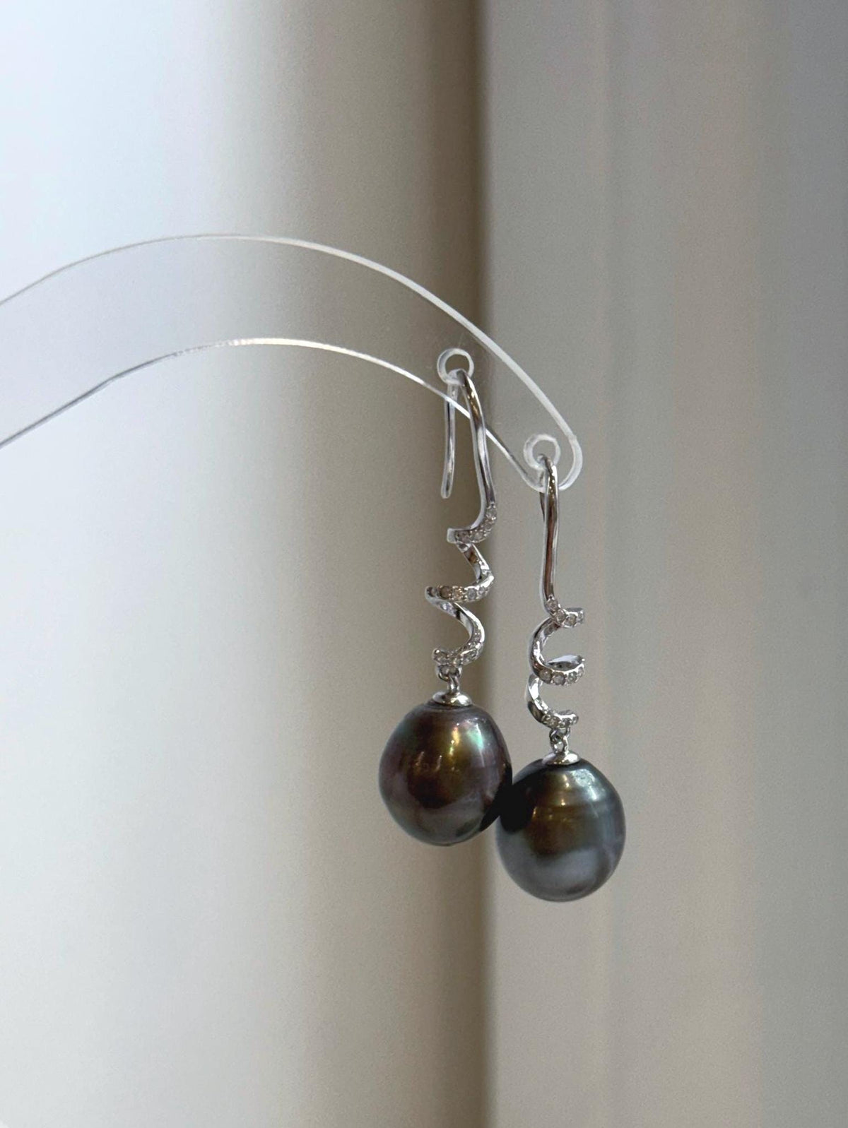 Genuine saltwater Tahitian pearl earrings featuring beautiful platinum green overtones