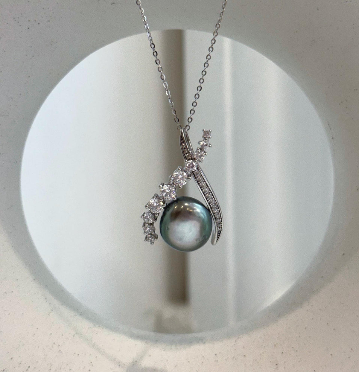 Tahitian peacock green Keshi pearl pendant with extreme luster and S925 sterling silver.