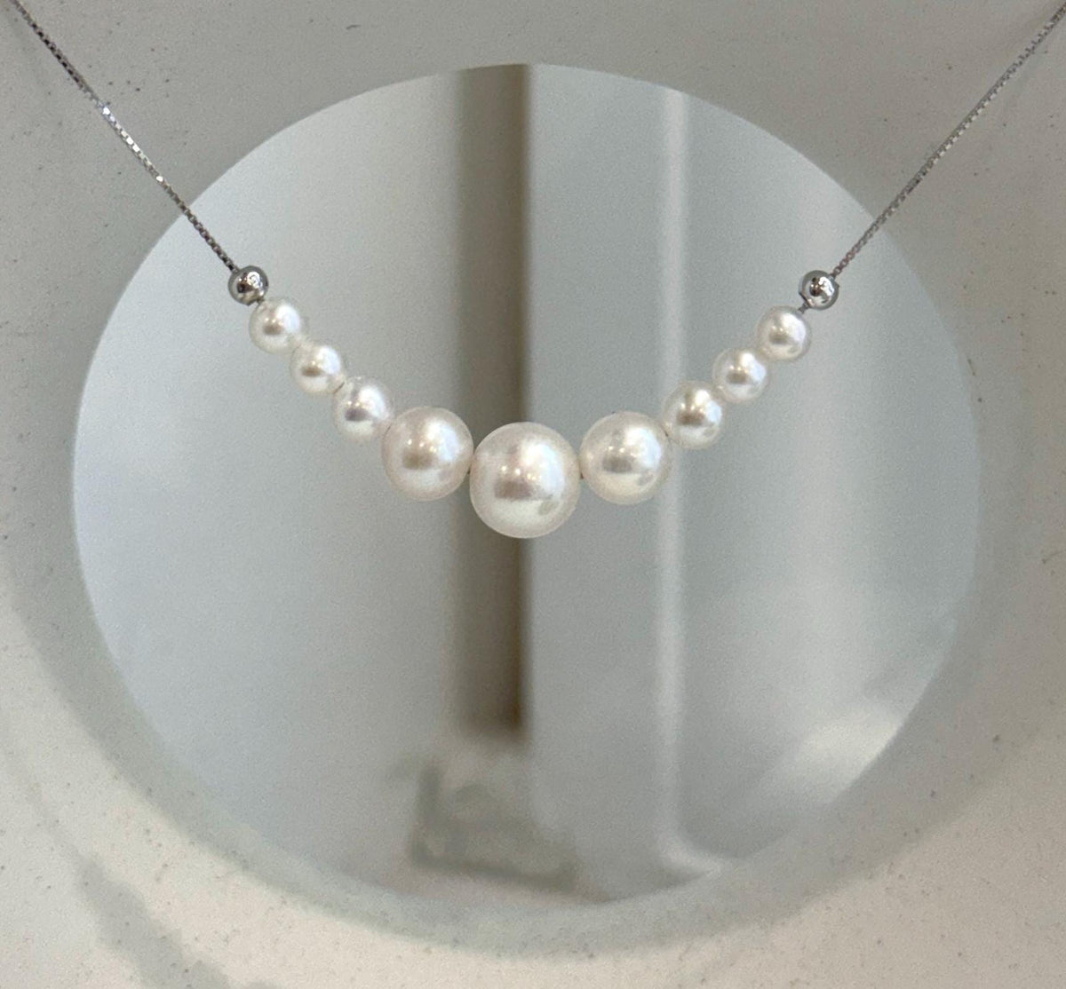 Freshwater white pearl smile necklace featuring ten genuine high-luster pearls and S925 sterling silver.