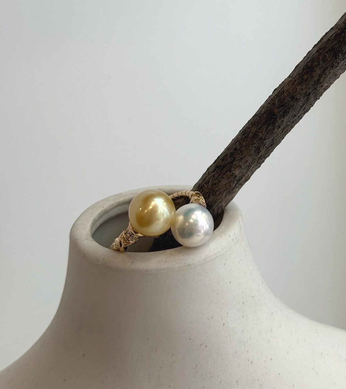 Handmade adjustable S925 silver ring featuring a pair of luminous golden freshwater pearls.