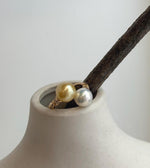 Handmade adjustable S925 silver ring featuring a pair of luminous golden freshwater pearls.