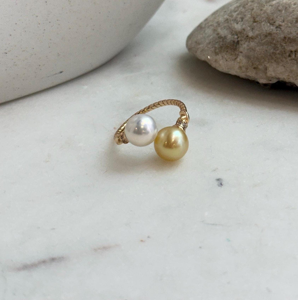 Double pearl open ring featuring natural golden freshwater pearls with bright reflective shine.