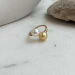 Double pearl open ring featuring natural golden freshwater pearls with bright reflective shine.