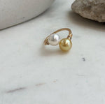 Genuine golden freshwater pearl ring with two round pearls and strong mirror-like luster.