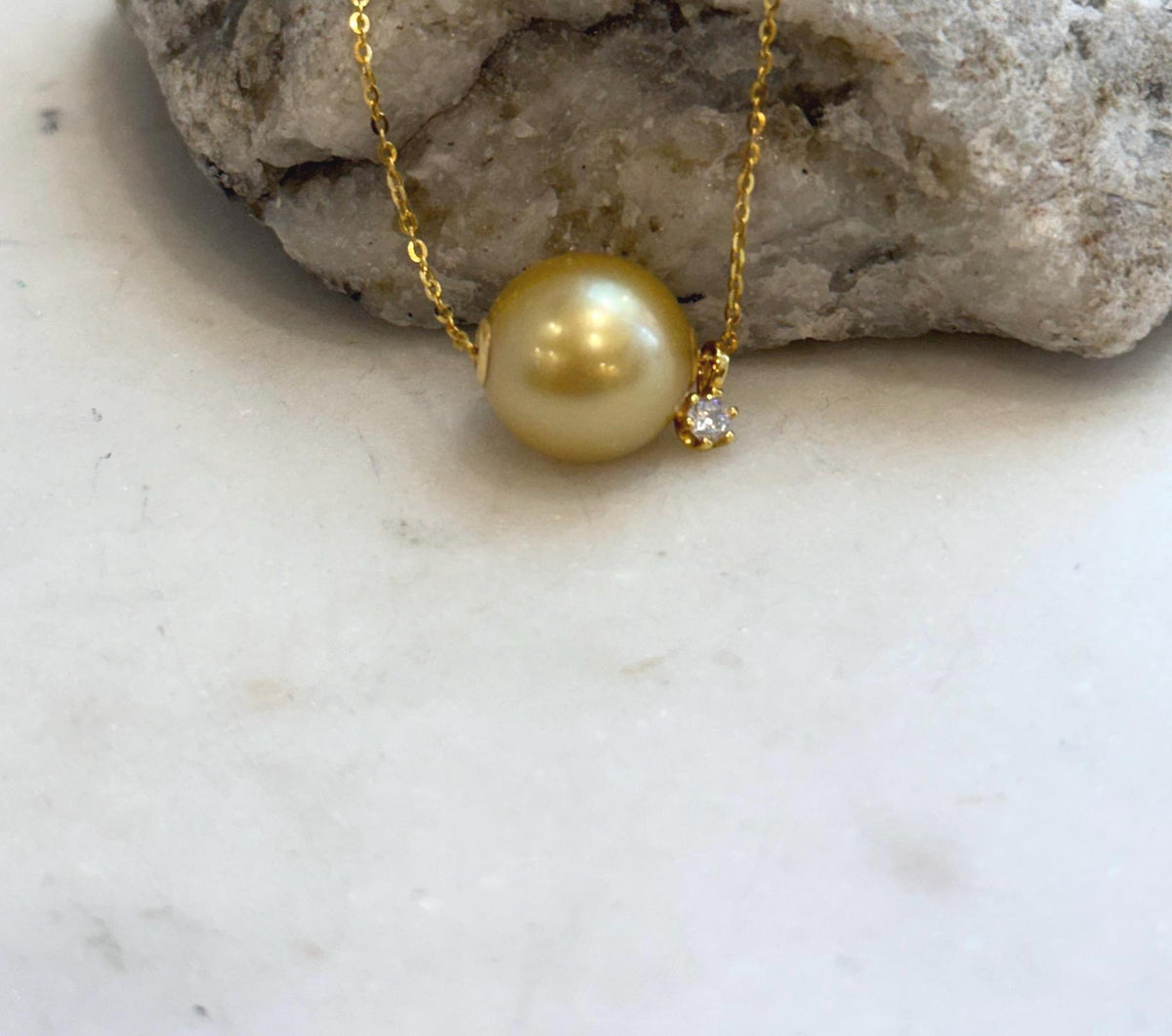 Large round deep golden South Sea pearl pendant with elegant minimalist design