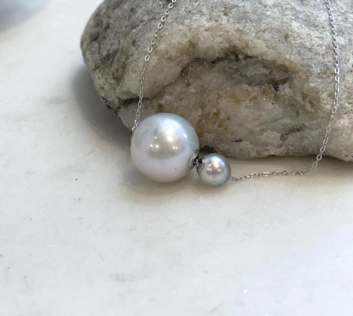 Elegant double pearl floating pendant with saltwater Akoya pearl and Edison pearl design