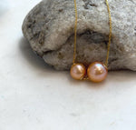 Elegant sunset gold Edison pearl floating necklace with rich golden tones and strong natural luster