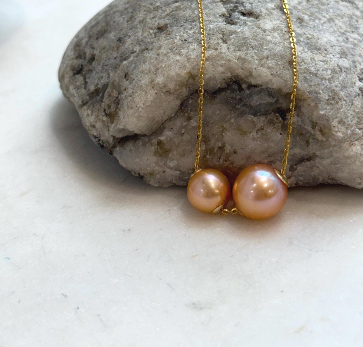 Elegant sunset gold Edison pearl floating necklace with rich golden tones and strong natural luster