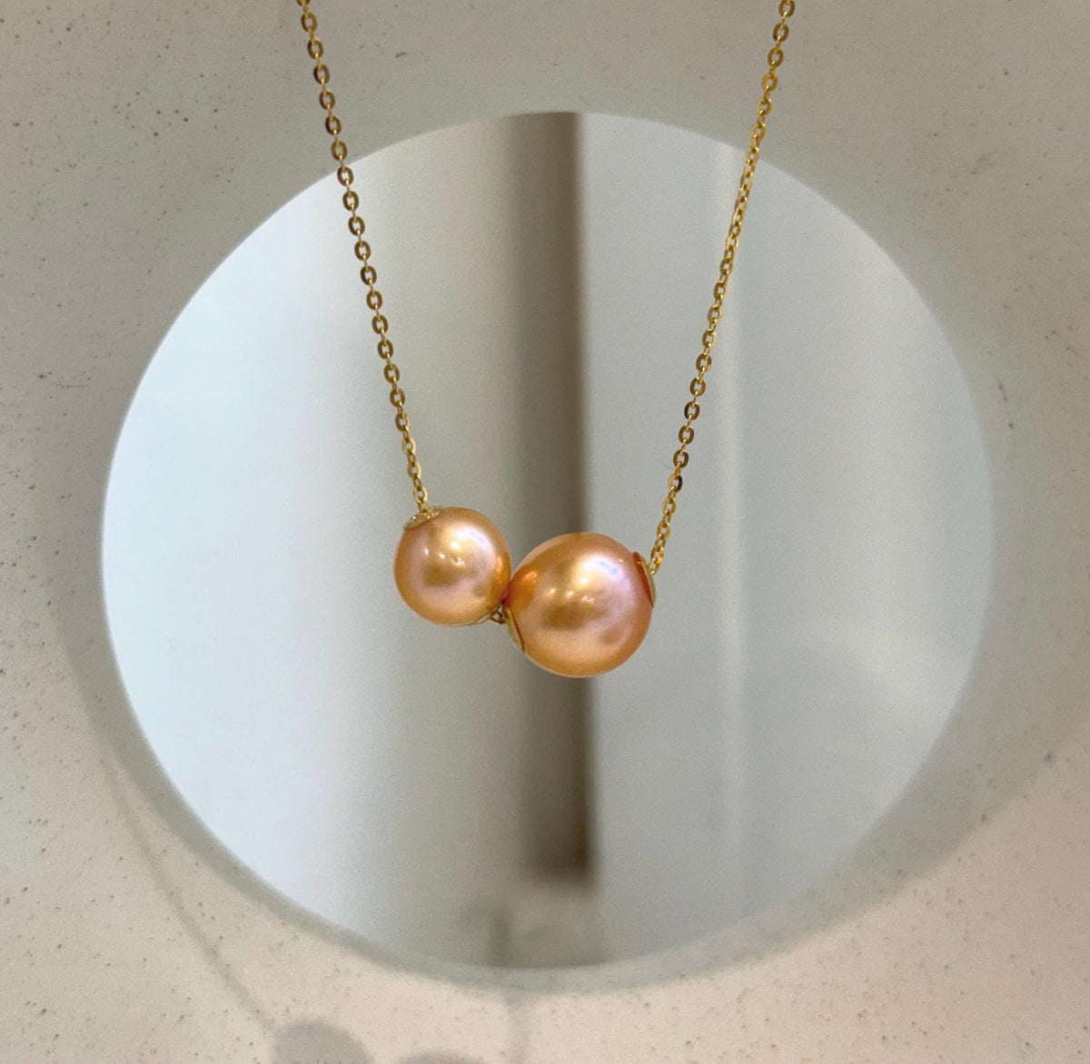Luxury double pearl pendant featuring genuine Edison pearls with smooth surfaces and mirror luster