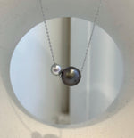 Elegant double pearl necklace with Tahitian and Akoya ocean pearls in a minimalist floating design
