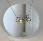 Double pearl bicycle necklace with Tahitian platinum and South Sea golden pearls.