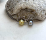 Tahitian platinum and golden pearl necklace with delicate bicycle design.