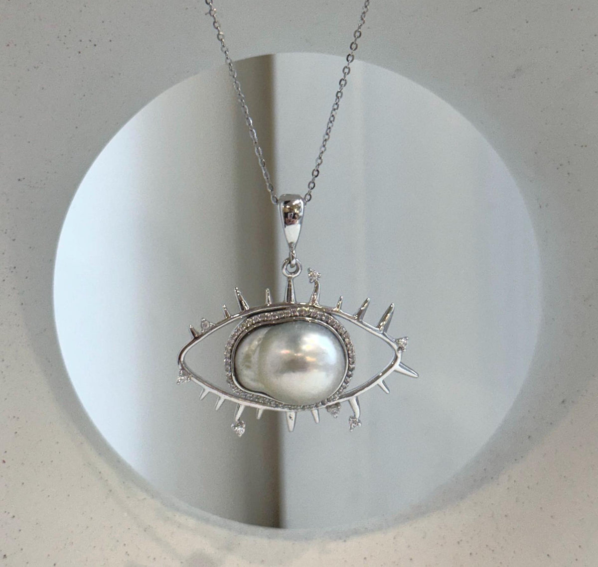 South Sea ocean pearl statement necklace with artistic evil eye pendant