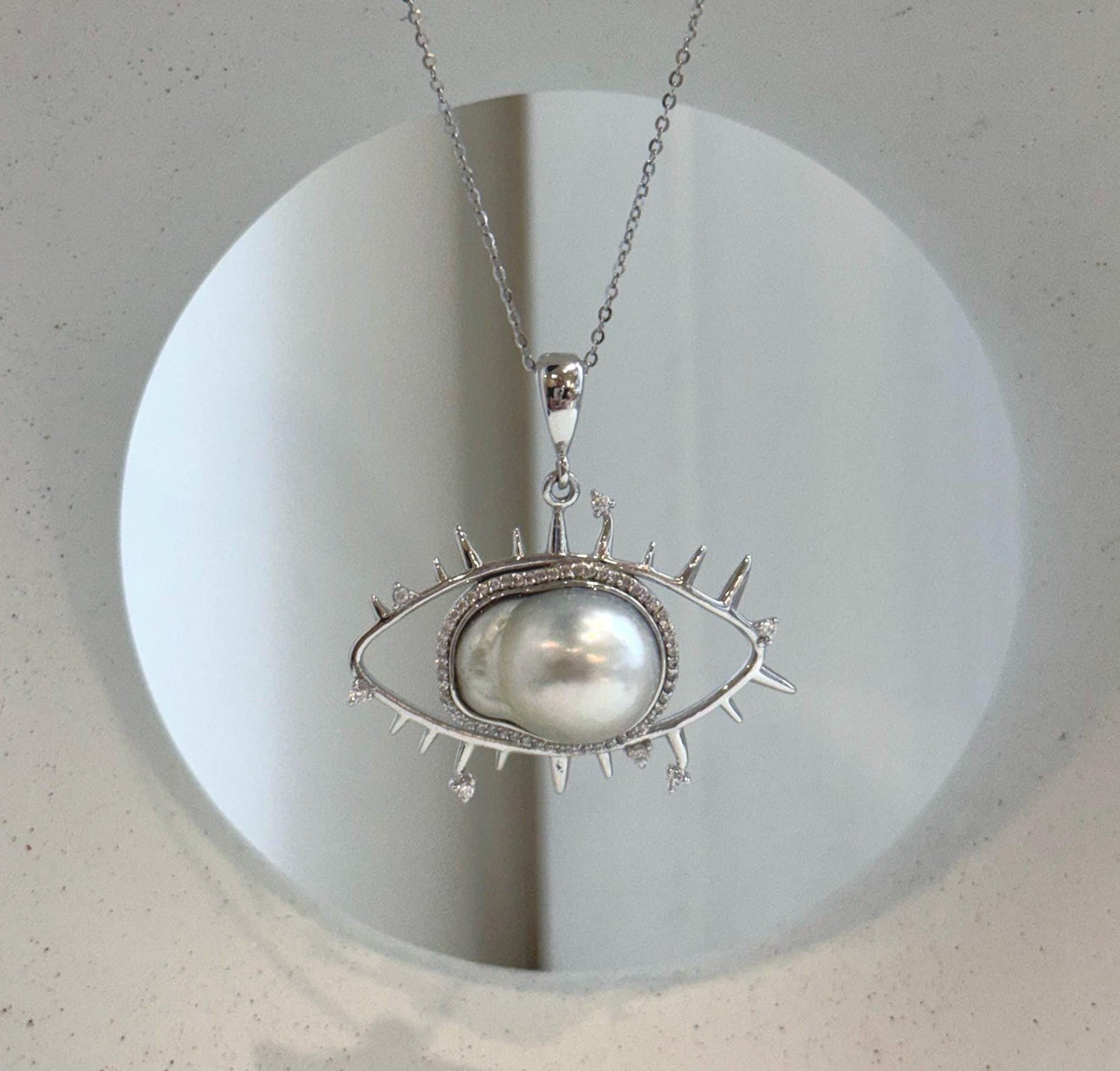 S925 sterling silver eye necklace featuring a genuine South Sea ocean pearl