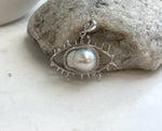 Genuine South Sea saltwater pearl set in a unique silver eye pendant design