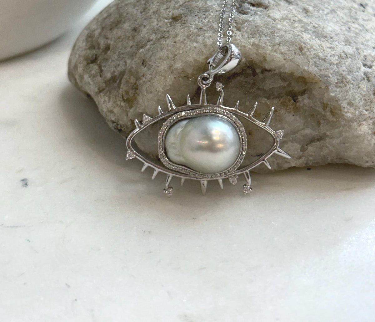 White baroque South Sea pearl pendant with bright luster and silver setting