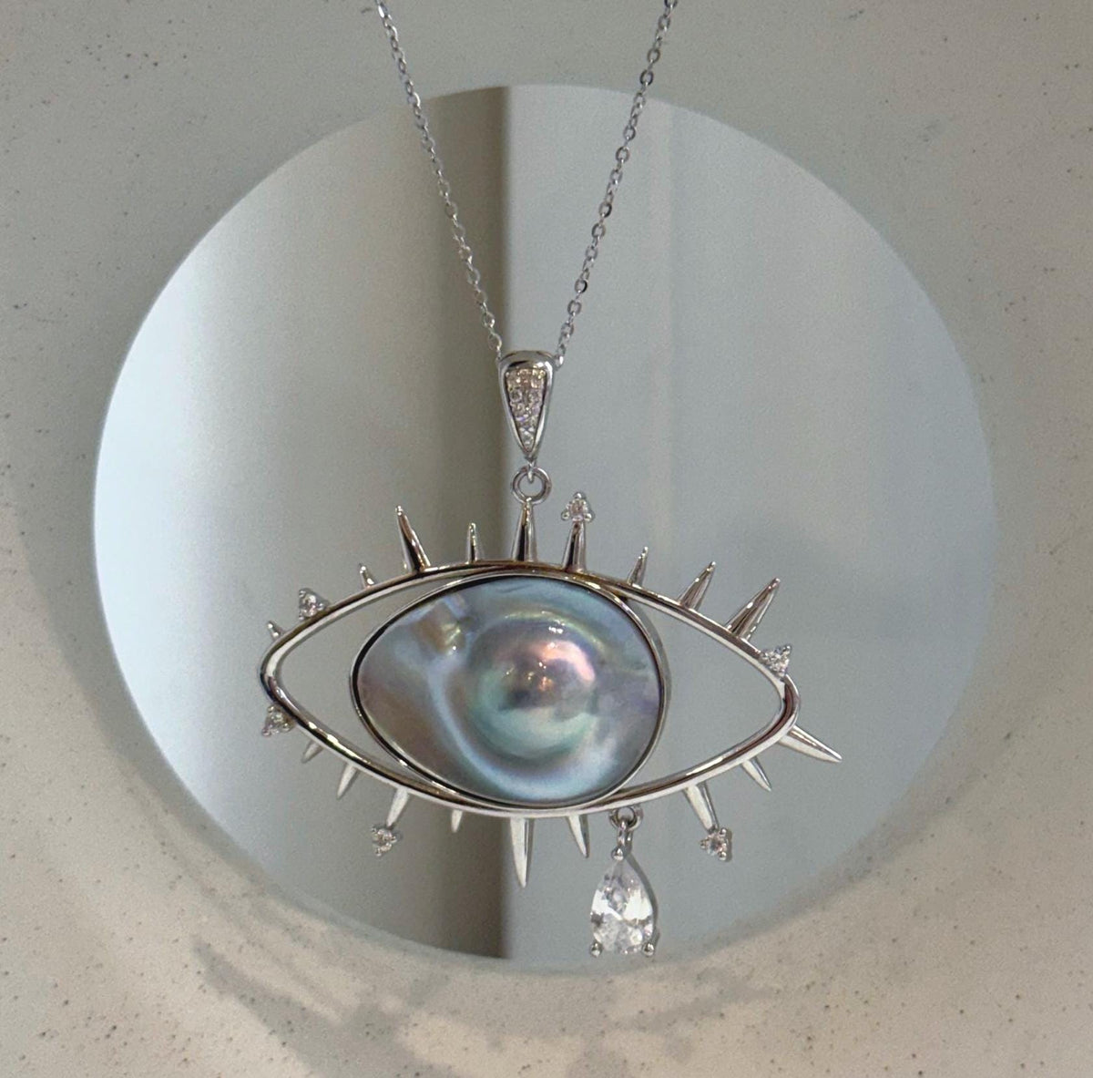 Statement Ocean Mabe pearl necklace with a modern eye-shaped design
