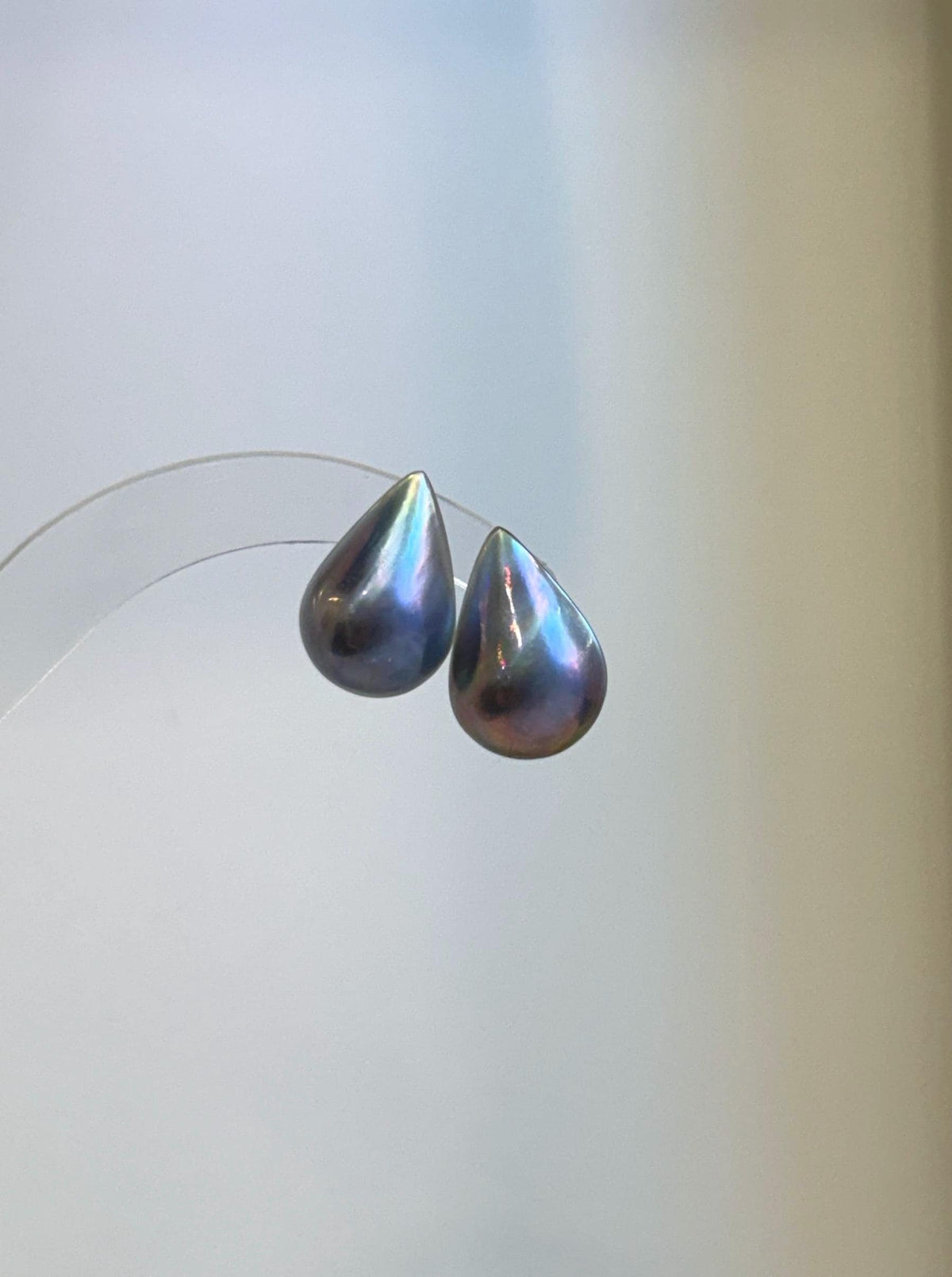Elegant Ocean Mabe pearl jewelry showcasing a large white pearl with bright mirror-like luster.