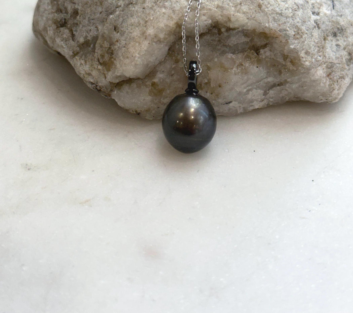 Genuine Tahitian ocean pearl pendant featuring a rich black chocolate color and mirror-like luster