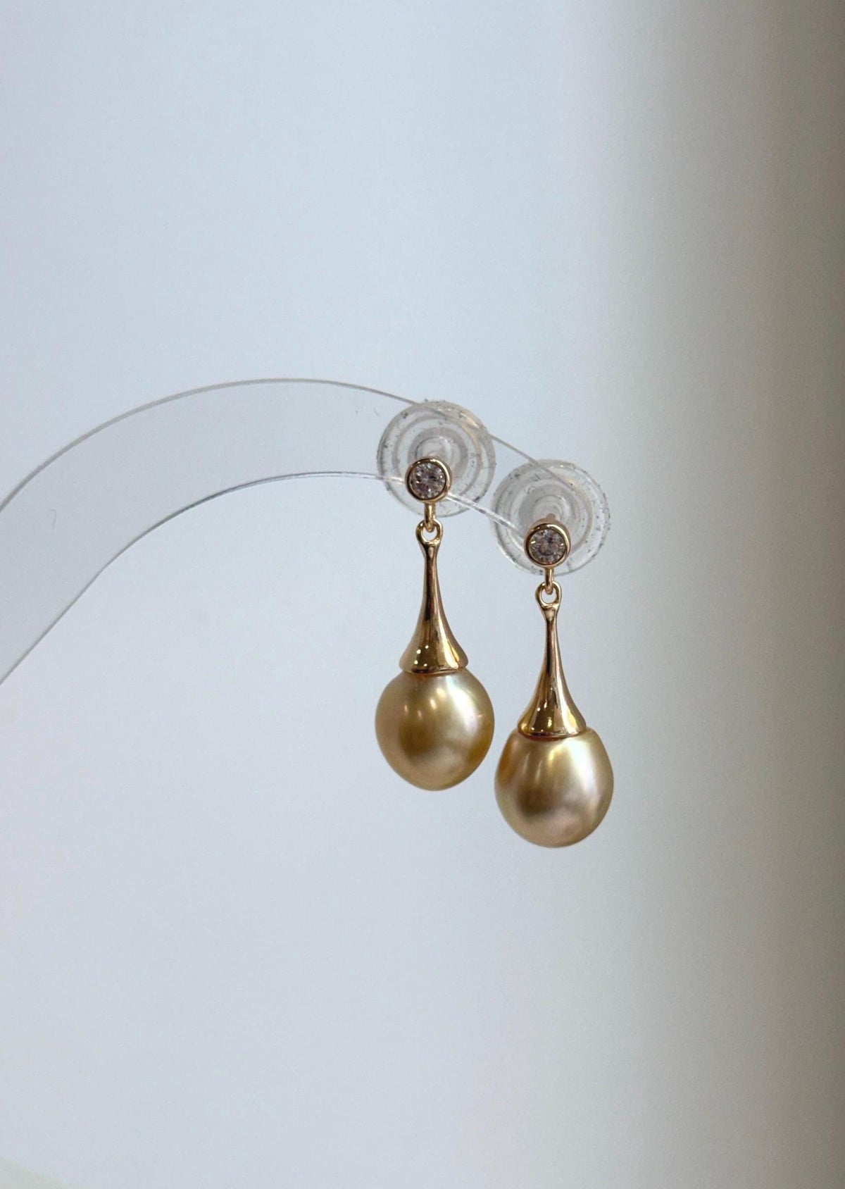 Deep tea golden ocean pearl earrings with sparkling round stud tops