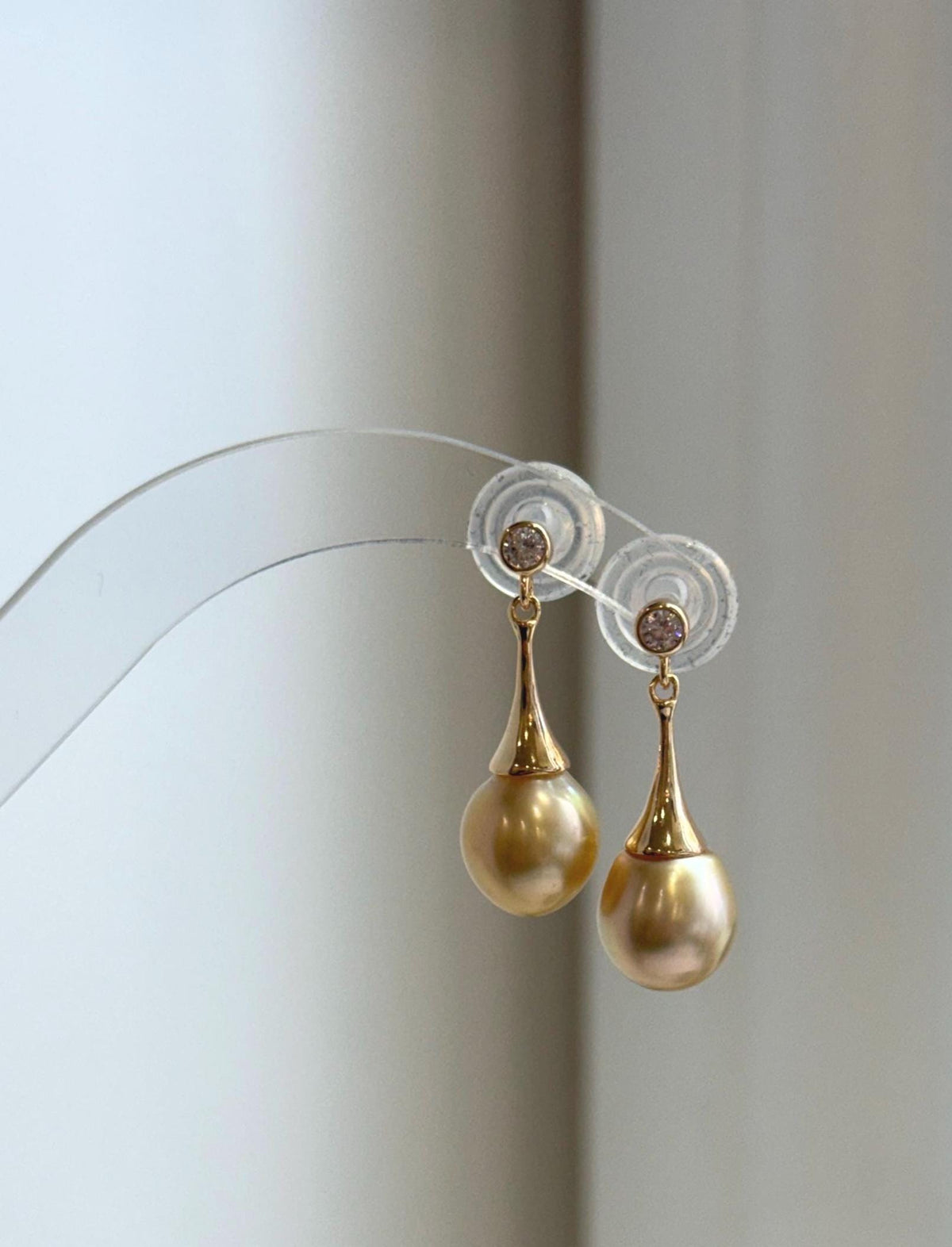 High-luster South Sea pearl earrings with rich deep tea golden color