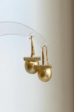 Genuine saltwater golden pearl earrings with elegant gold-plated hooks